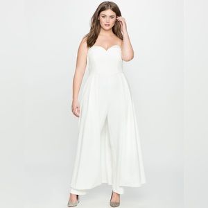 White strapless jumpsuit with dramatic cape